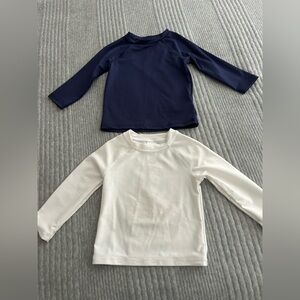 Toddler long sleeve rash guards. 1 navy blue 1 white. Size 18 months.